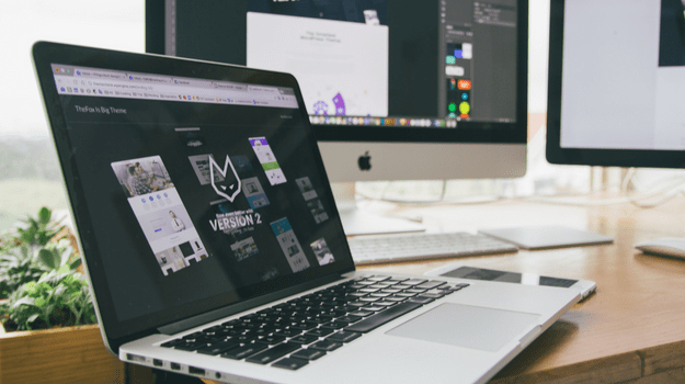 designing website on laptop