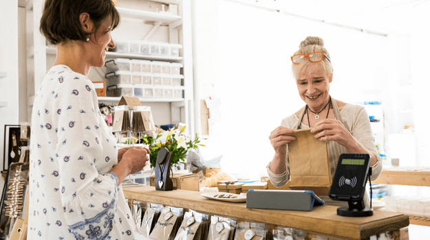 woman packaging purchase for customer