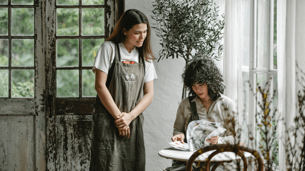 Businessowner Talking to a Customer